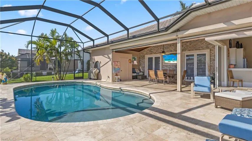 View of the lanai and pool.  There is also a storage closet which iis convenient to  store pool toys etc.