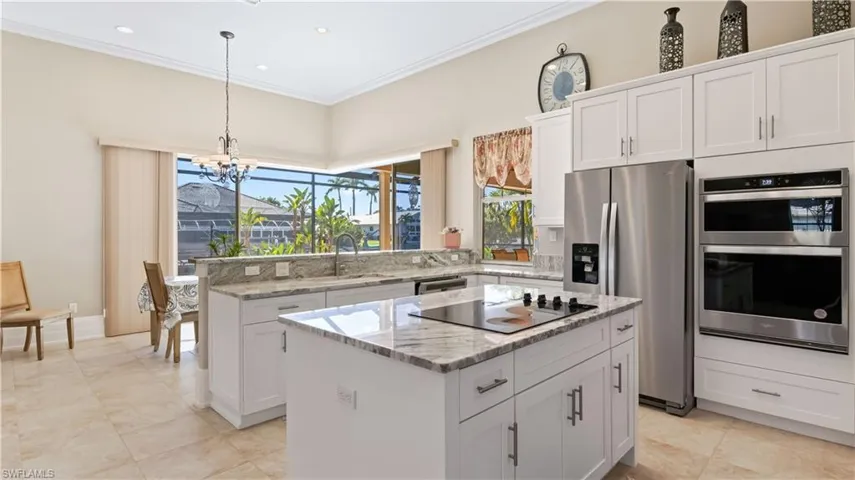 There are kitchens and then there are KITCHENS!  This sprawling kitchen was just remodeled with brand new cabinets and appliancces and in addition to the large kitchen island, it also contains an additional island - double the islands, double the space for entertaining!  Beautiful countertops add to the soothing neutral paint palette.  There is also tons of space including a large walk in pantry with plenty of room for large appliances.