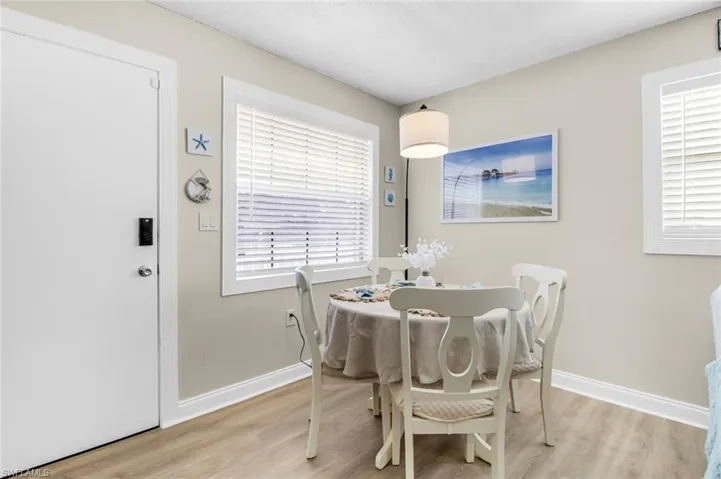 Dining space with light wood finished floors and baseboards