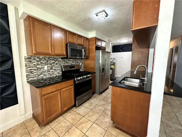 With gas range and stainless appliances