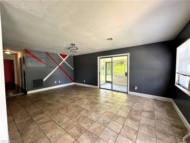 Living room with slider to screened lanai