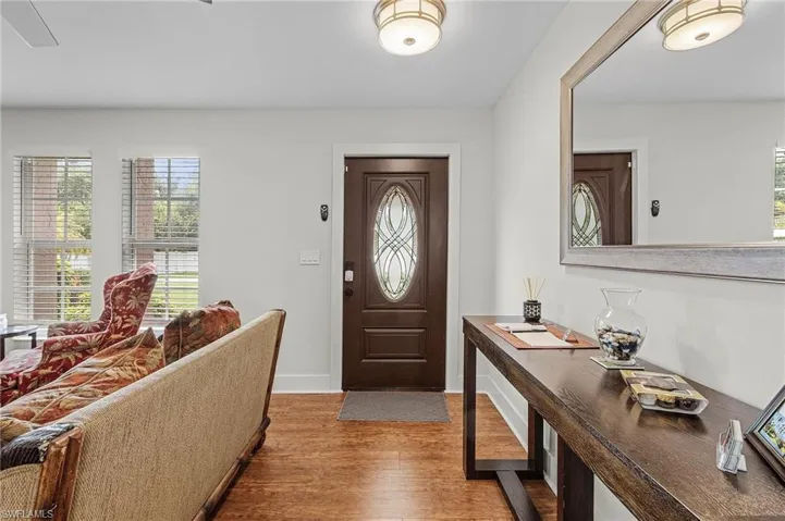 Foyer with hardwood / wood-style flooring