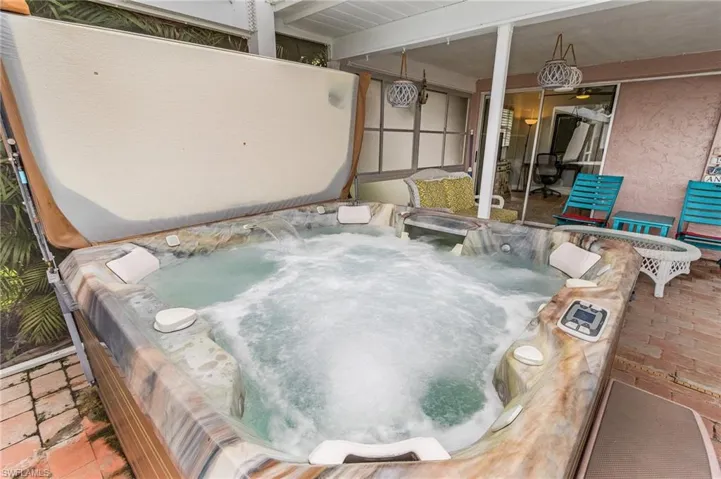 View of patio / terrace featuring a hot tub