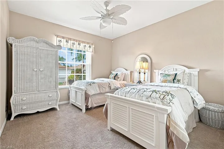 Third bedroom with neutral colors, carpeted flooring, window with blinds, and a ceiling fan