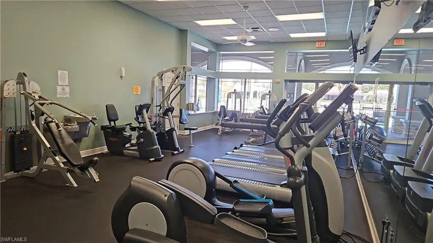 Exercise room featuring a high drop ceiling