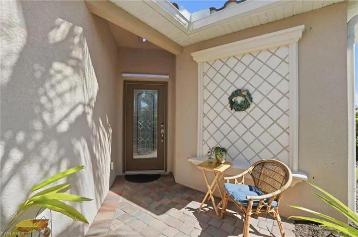 Entrance to property featuring stucco siding