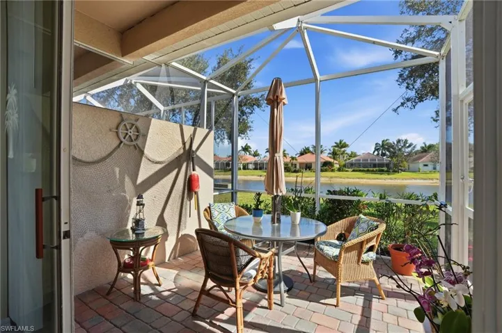 Sunroom / solarium featuring a patio, a residential view, and outdoor dining space