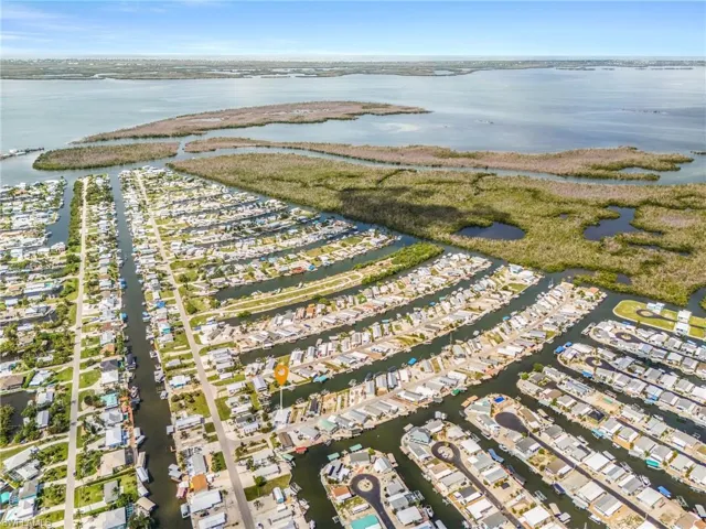 Aerial perspective showcasing a waterfront community with extensive canal access