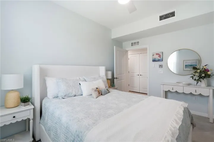 Light blue painted walls complement white trim and a white ceiling fan