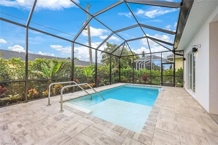 View of pool featuring a lanai and a patio