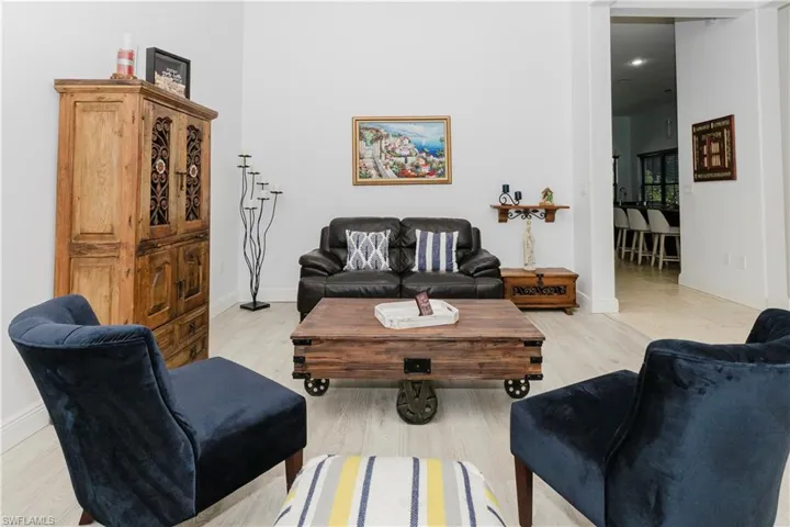 Living room featuring baseboards and light wood-type flooring