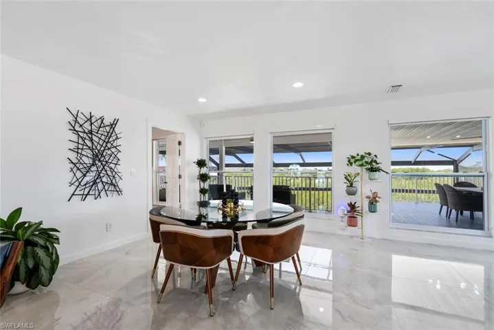 Dining area with recessed lighting, baseboards, marble finish floor, and visible vents