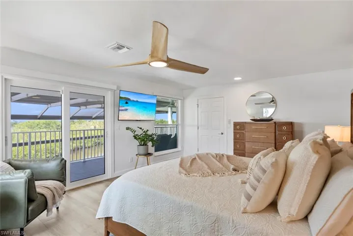Bedroom featuring visible vents, access to exterior, ceiling fan, recessed lighting, and light wood-style flooring