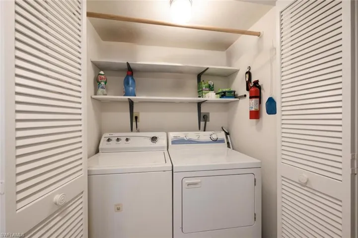 Washroom featuring washer and clothes dryer