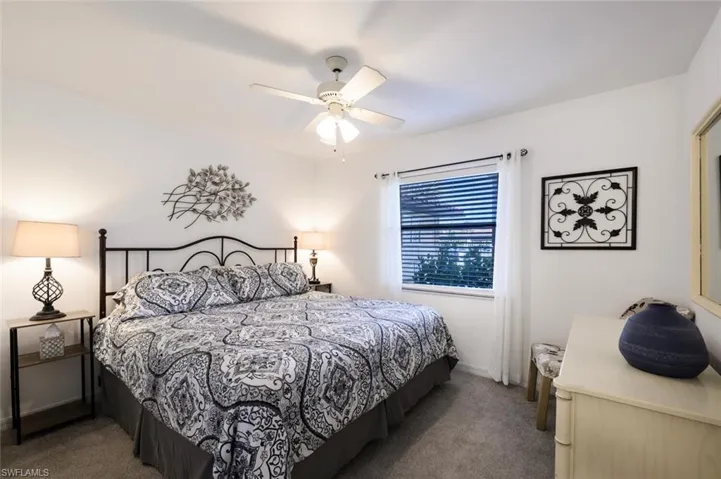 Bedroom with carpet and ceiling fan