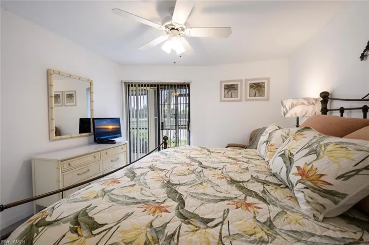 Bedroom with access to outside and a ceiling fan