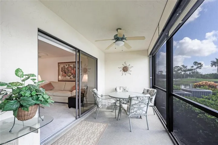 Sunroom / solarium featuring ceiling fan