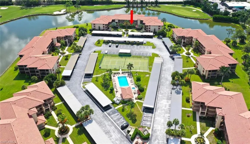 Bird's eye view of a golf course and a nearby body of water