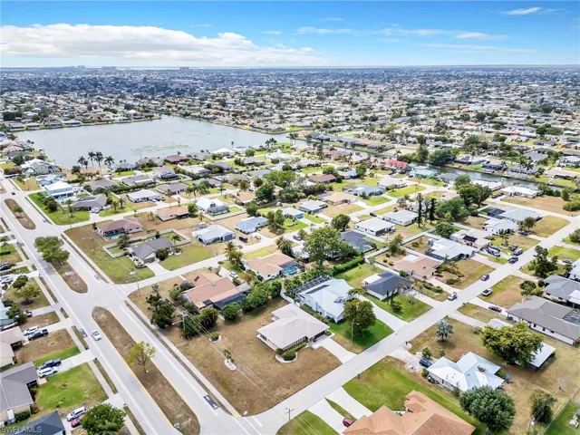 Drone / aerial view with a residential view and a water view