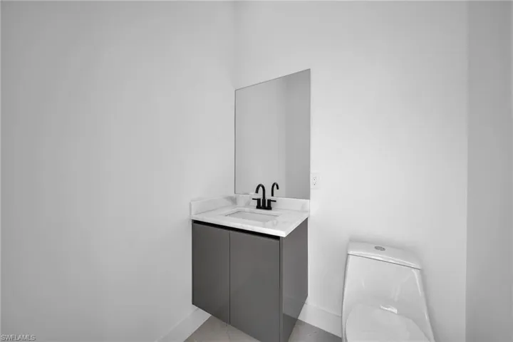 Bathroom featuring vanity and toilet