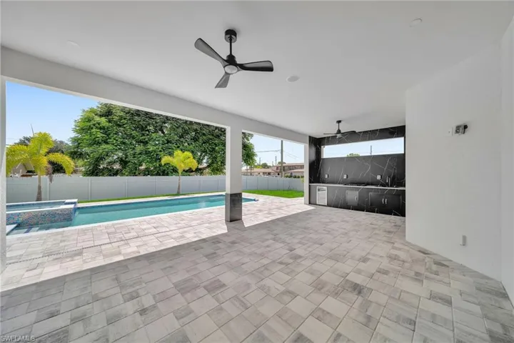 View of pool featuring ceiling fan and a patio
