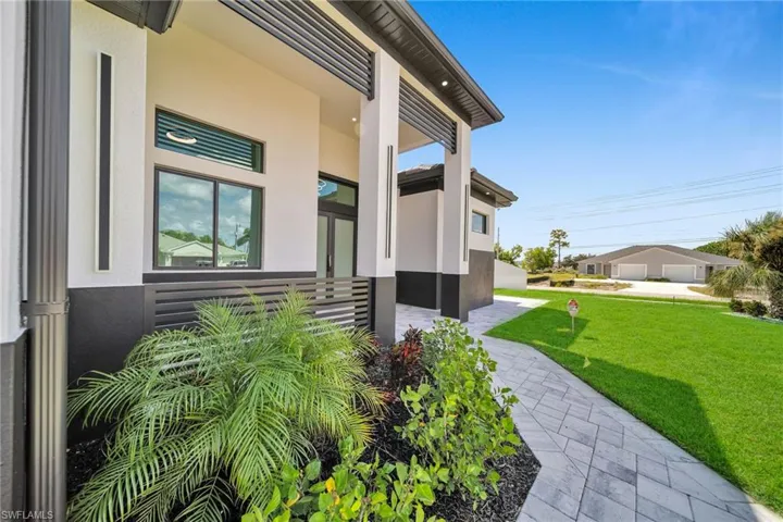Property entrance with a lawn