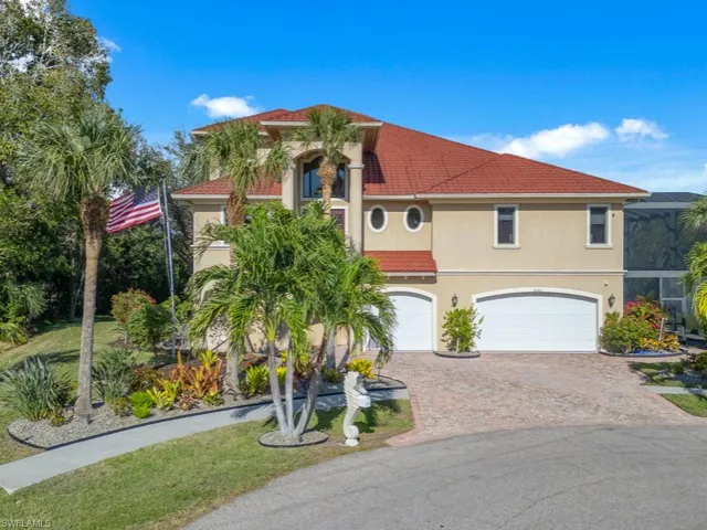 Mediterranean / spanish-style house with a garage