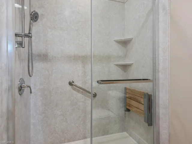 Bathroom with a shower with shower door