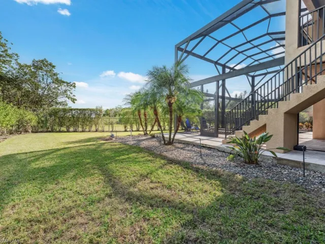 View of yard featuring a lanai