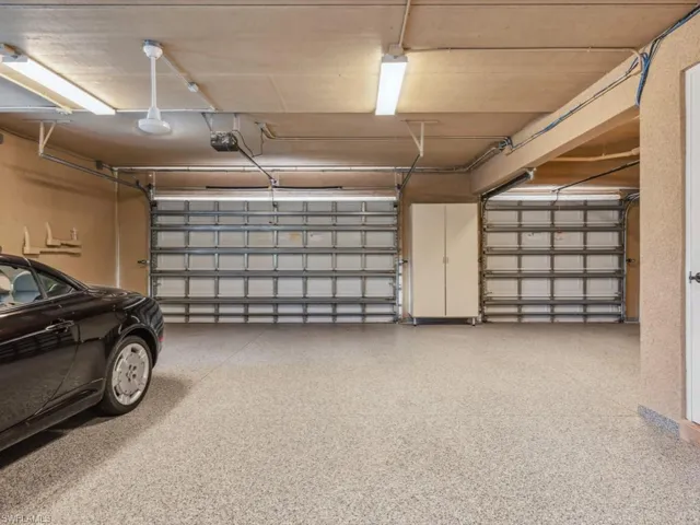 Garage featuring a garage door opener