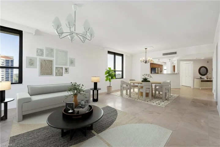 Living room with a chandelier and ornamental molding