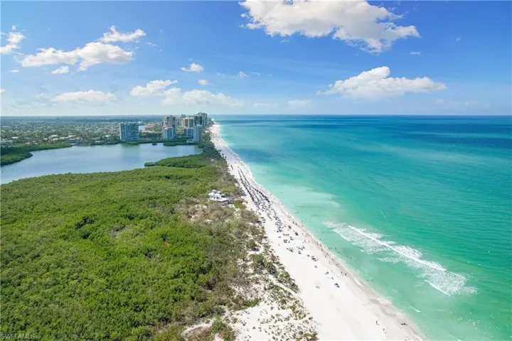 Bird's eye view with a water view and a beach view