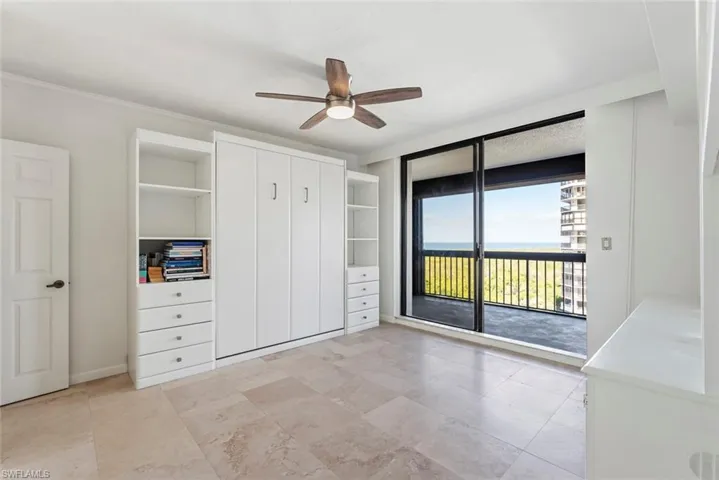 Unfurnished bedroom with ceiling fan, ornamental molding, access to outside, and a closet
