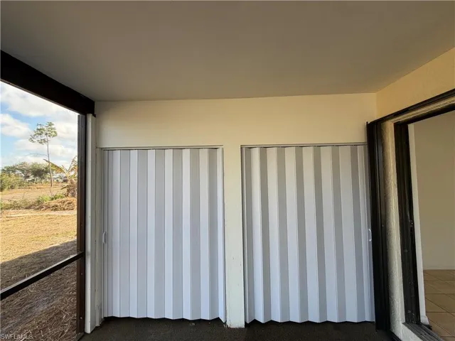 patio looking at washer and dryer and storage doors
