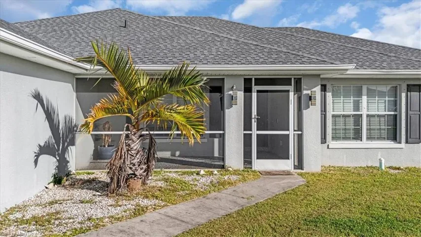 Property entrance featuring covered porch
