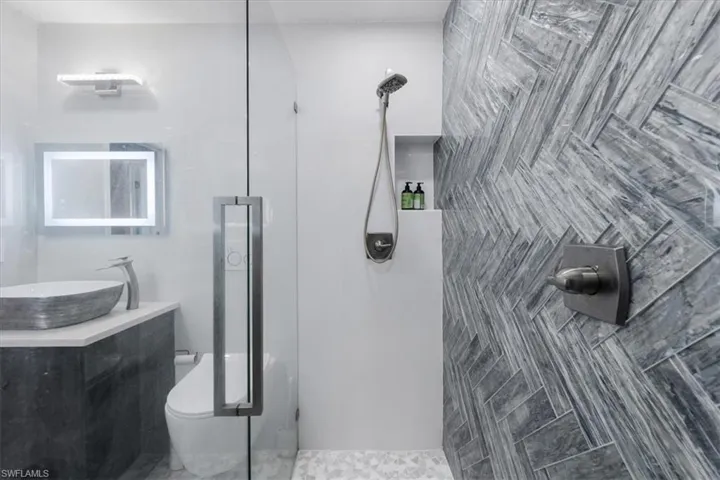 Bathroom featuring vanity and wood-type flooring