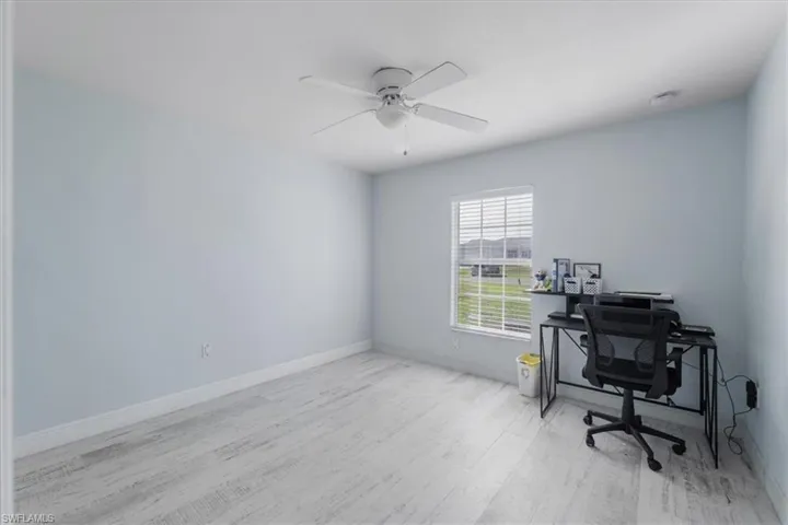 Office featuring light hardwood / wood-style flooring and ceiling fan