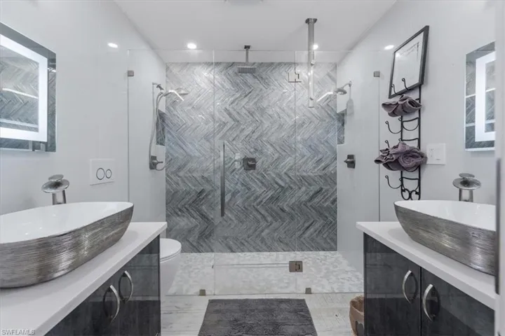 Bathroom with vanity and hardwood / wood-style flooring