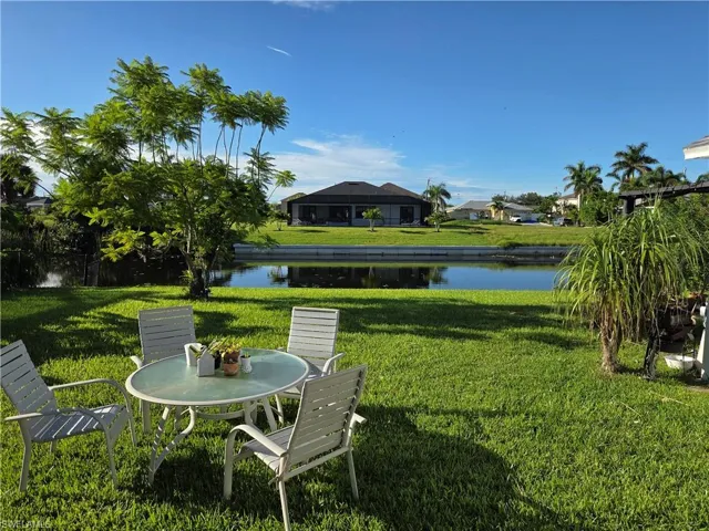 View of green lawn with a water view