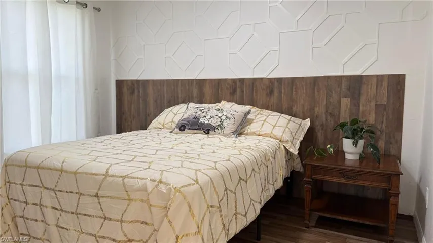 Bedroom with wood finished floors