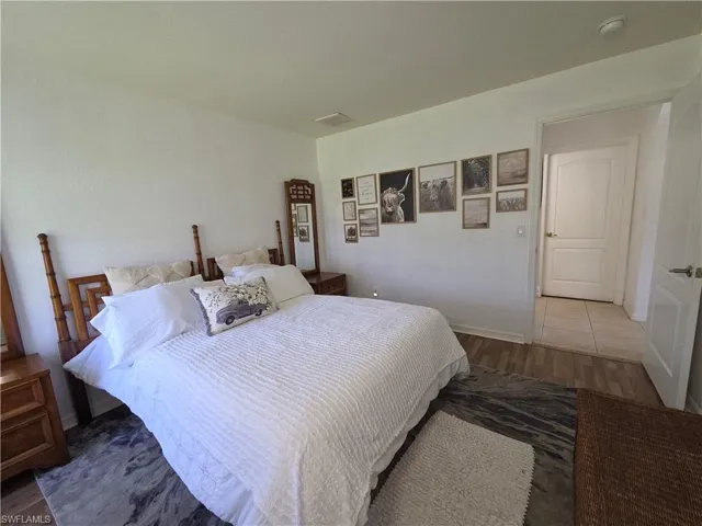 Bedroom with wood finished floors
