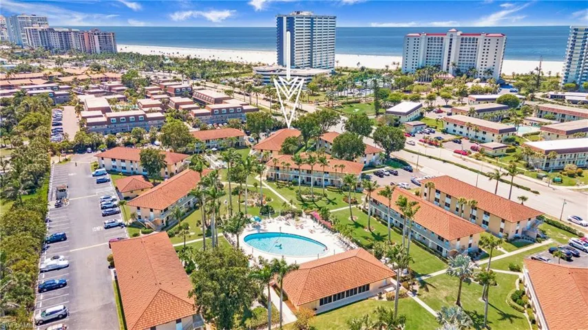 Aerial view of Community pinpointing location of condo