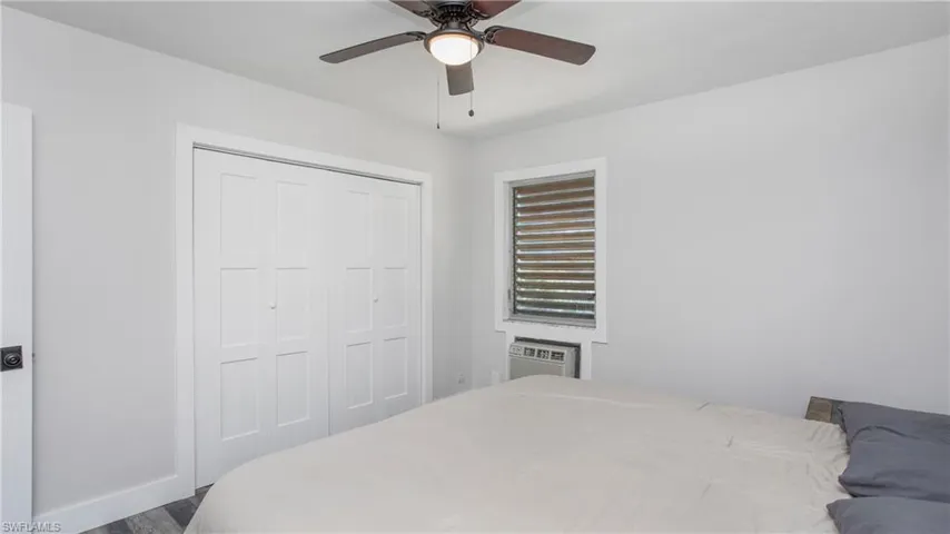 Bedroom 1 with showing closet with updated doors