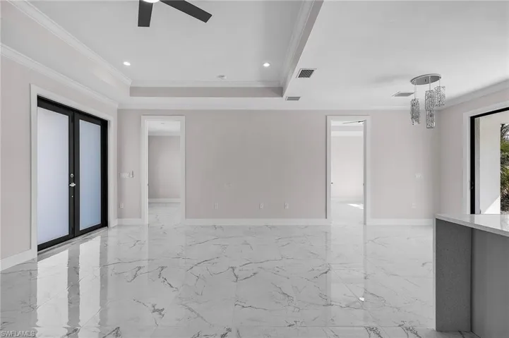 Unfurnished room with ornamental molding, recessed lighting, a ceiling fan, and visible vents