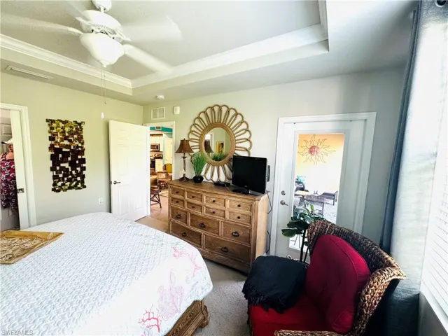 Master bedroom with door to screened lanai