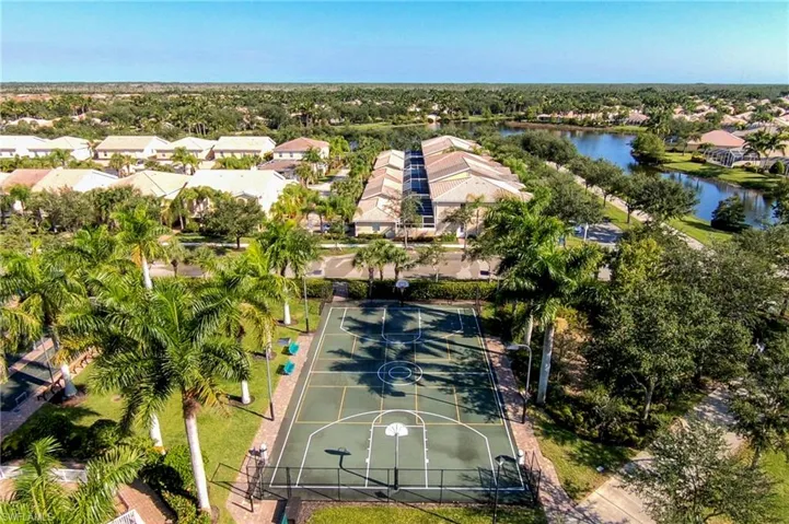 Aerial view of residential area featuring a large body of water