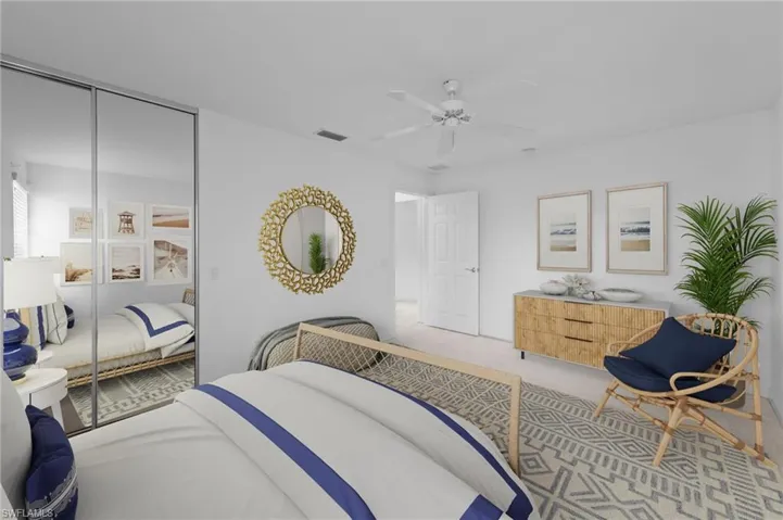 Bedroom featuring a closet, a ceiling fan, and carpet floors