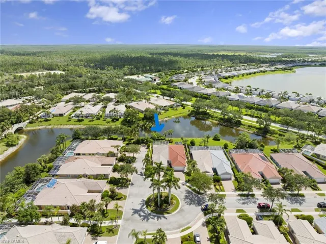 Aerial perspective of suburban area with a large body of water