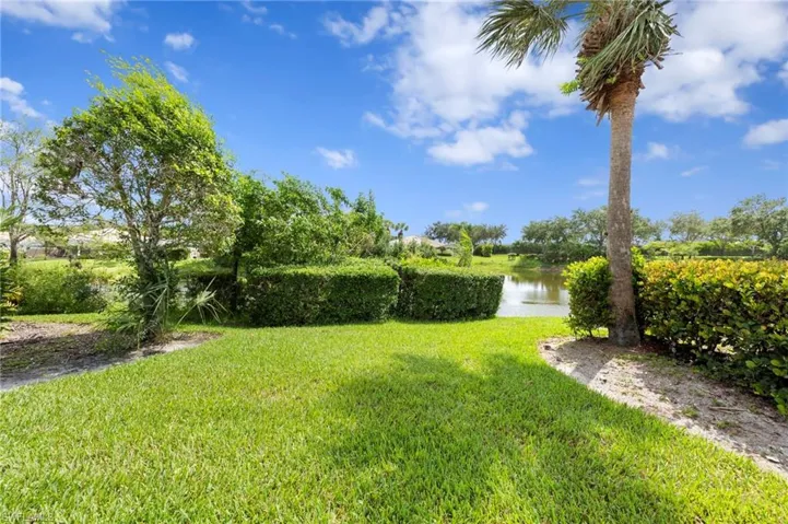 View of green lawn with a water view