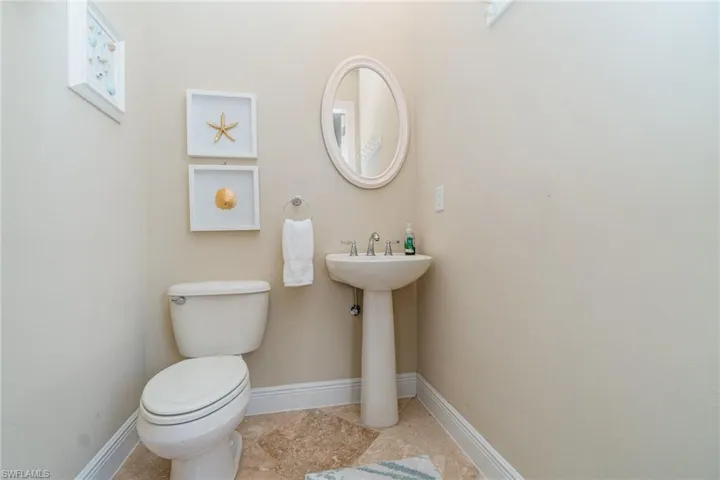 Bathroom featuring tile patterned floors and toilet